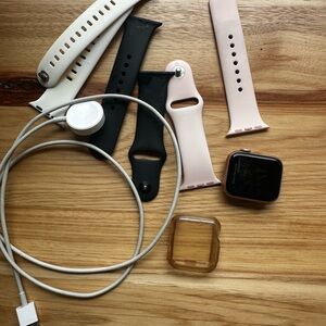 Apple Watch with protection and Pink, White and Black Silicone Bands and Charger